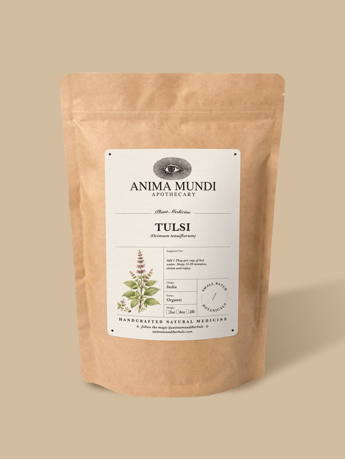 A kraft paper stand-up pouch of Anima Mundi Apothecary Tulsi herbal medicine, featuring a white label with botanical illustrations, set against a solid beige background.